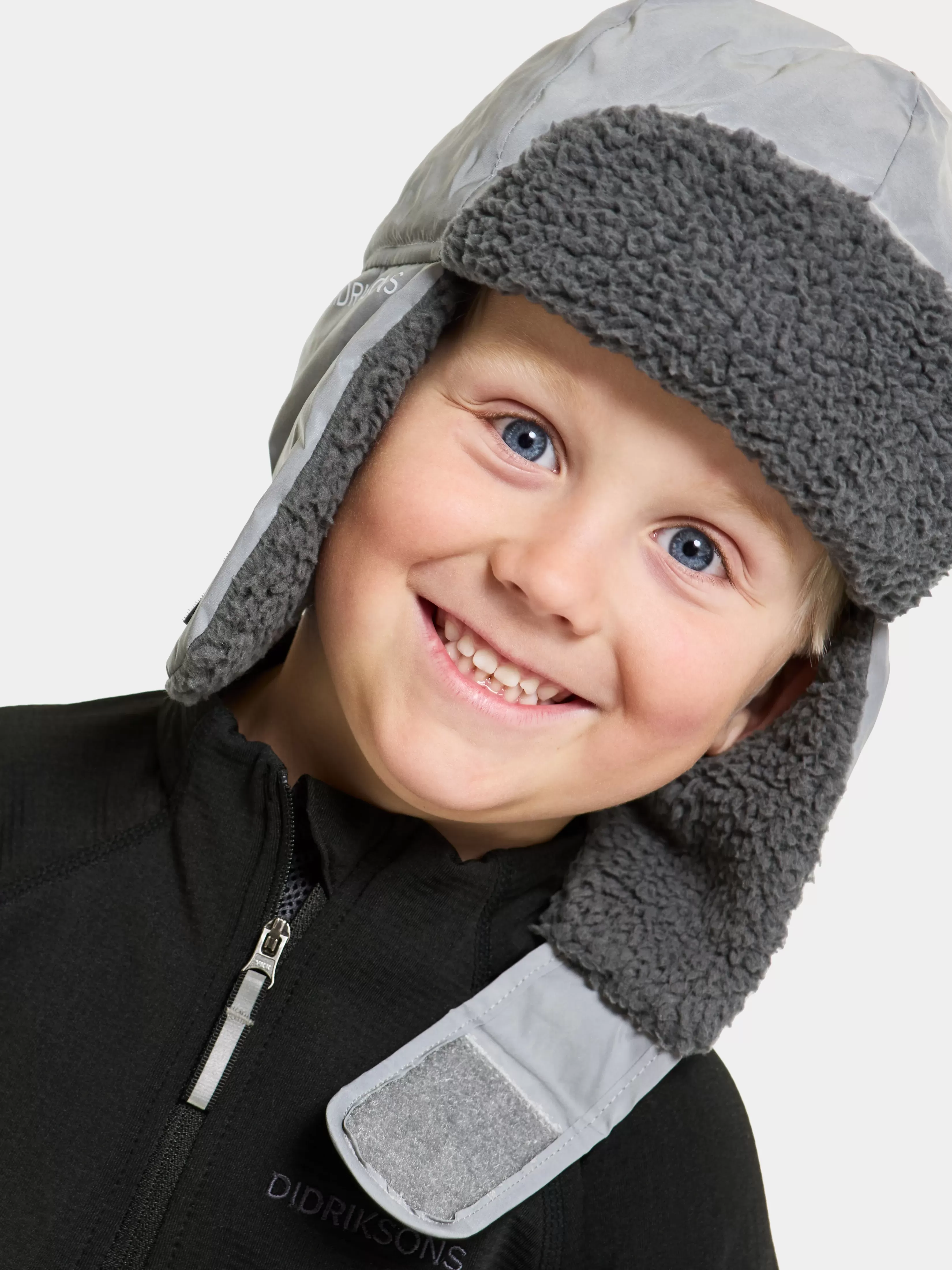 Didriksons Biggles Reflective Kids' Cap>Barn Luer & Capser